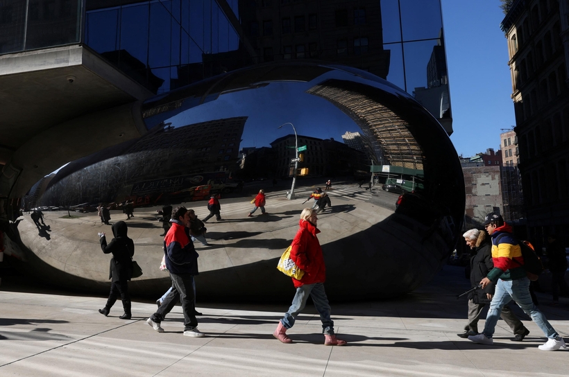 New Yorkers walking by Anish Kapoor’s “bean” sculpture at 56 Leonard Street, in Tribeca.
